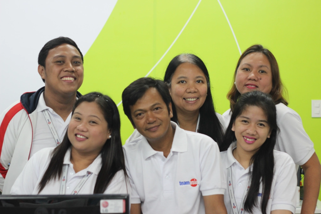 Lorna with the Finance team, during the blessing of the new office in 2016